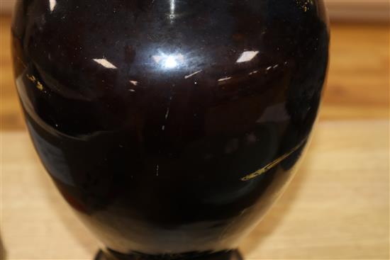 An 18th century Chinese gilt decorated mirror black glazed baluster vase, drilled hole